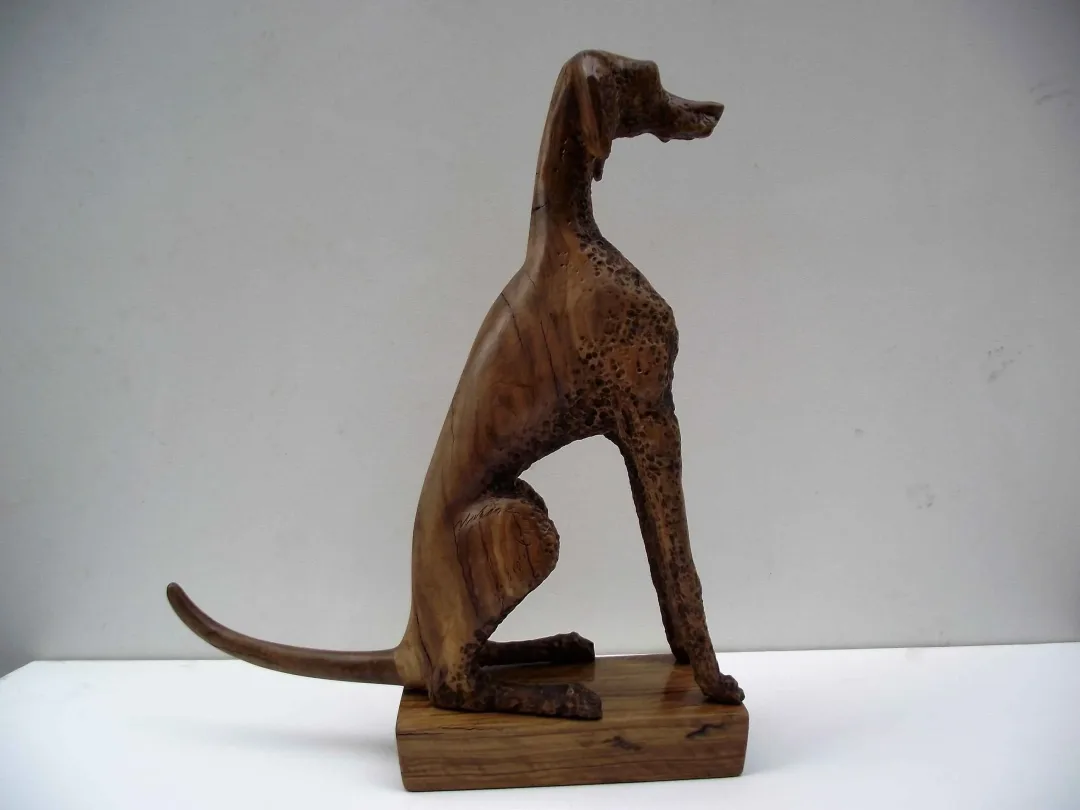 yakınlaştır "Weimaraner" eseri HAKAN ERASLAN tarafından 2016 yılında 40x47x11 cm ölçülerinde Zeytin Ağacı Yontu tekniği ile yapılmıştır.